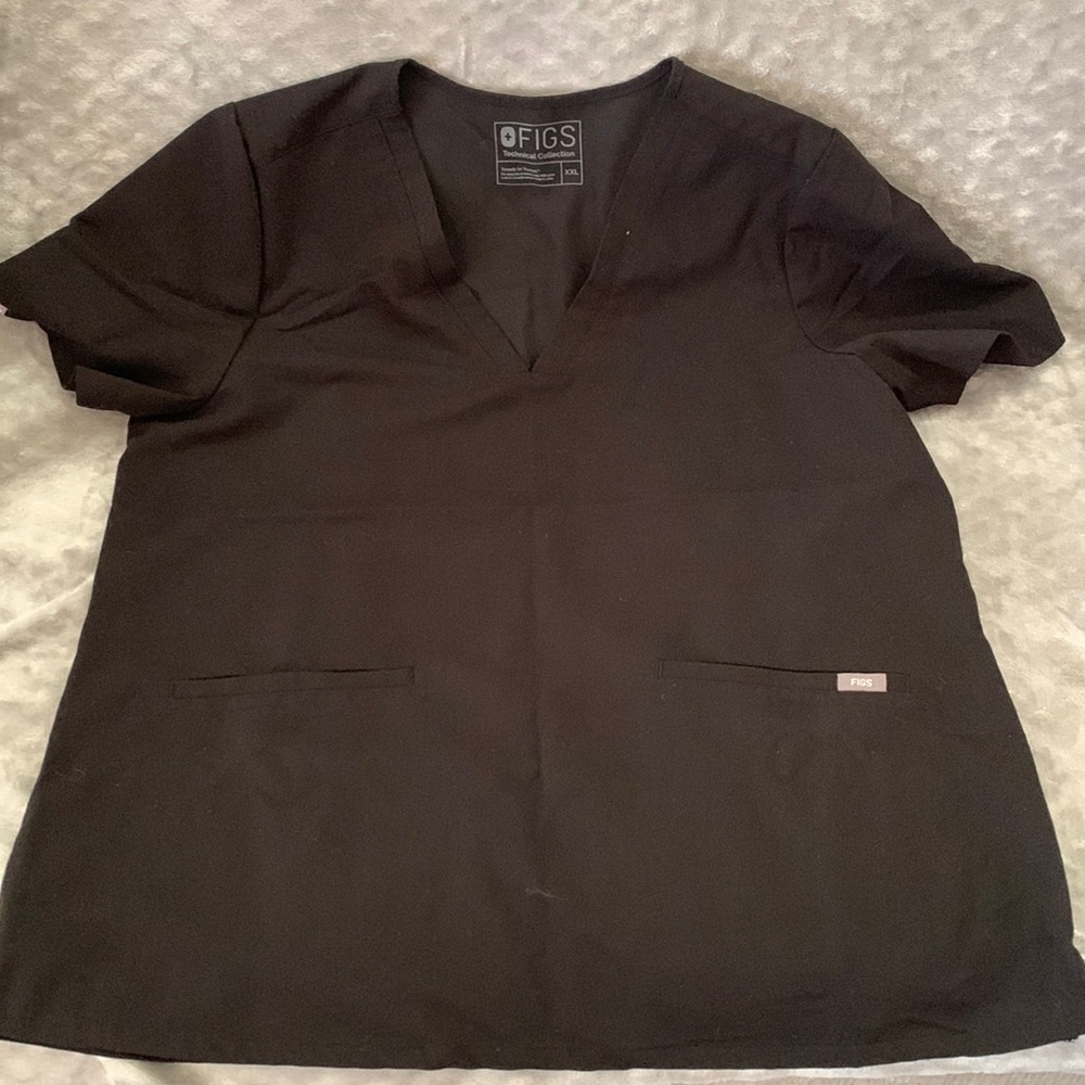 Black three pocket scrub top. Never worn.